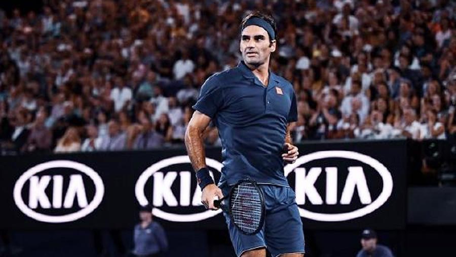 Federer sweeps into open round two