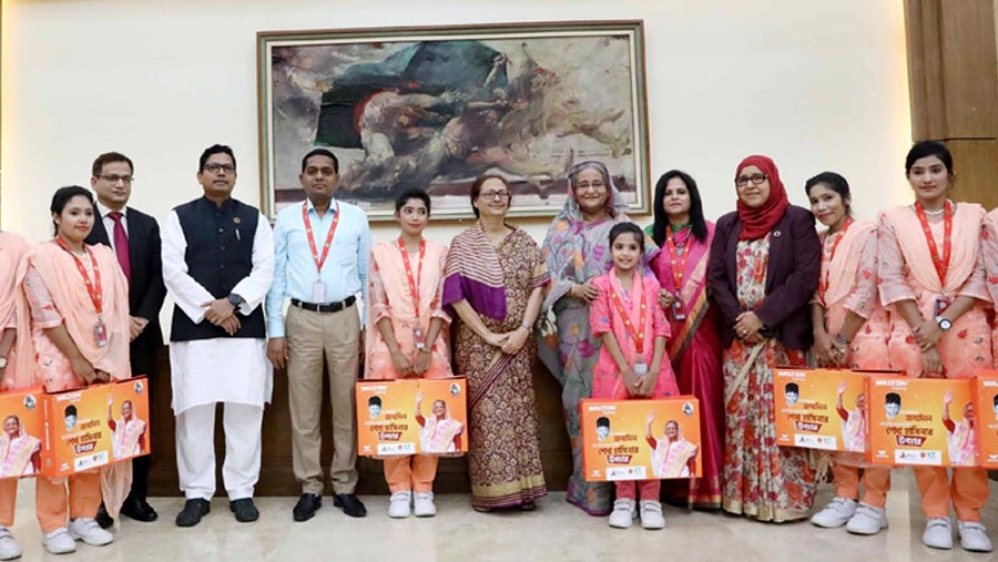 PM presents laptops, sewing machines to Shishu Paribar members